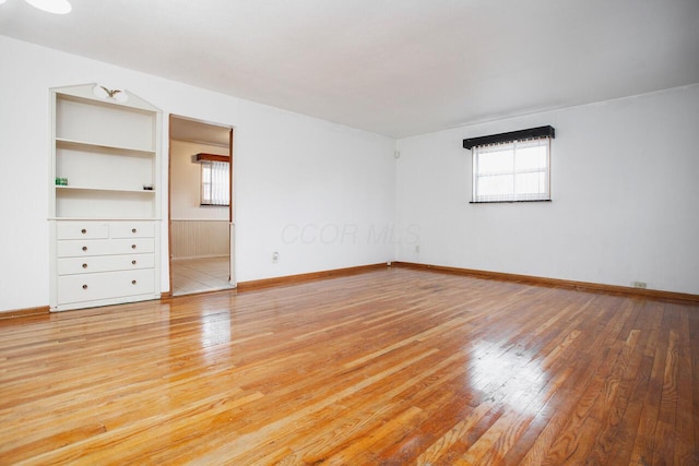 unfurnished room featuring hardwood / wood-style floors