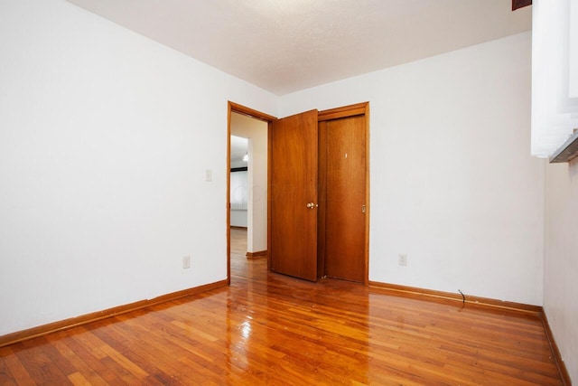 unfurnished room featuring light hardwood / wood-style floors