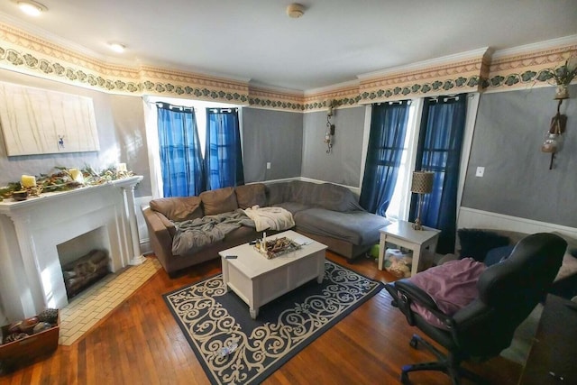 living room with ornamental molding and dark hardwood / wood-style flooring