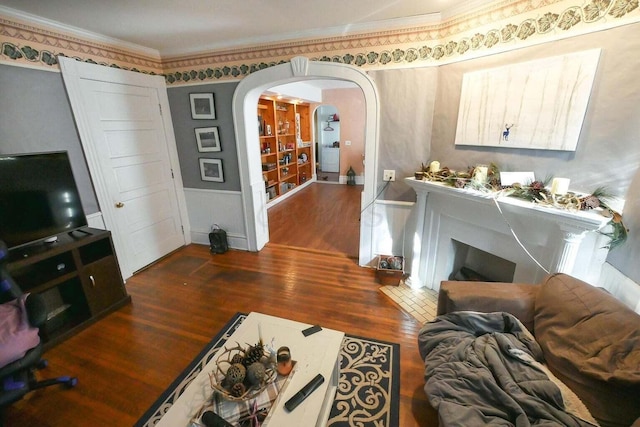 living room with crown molding and dark hardwood / wood-style floors