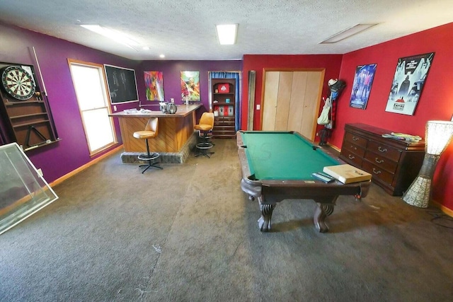 playroom with indoor bar, pool table, carpet, and a textured ceiling