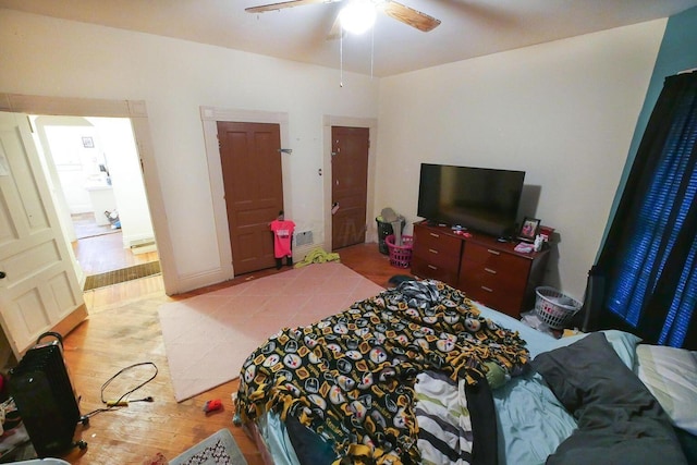 bedroom with ceiling fan and light hardwood / wood-style flooring