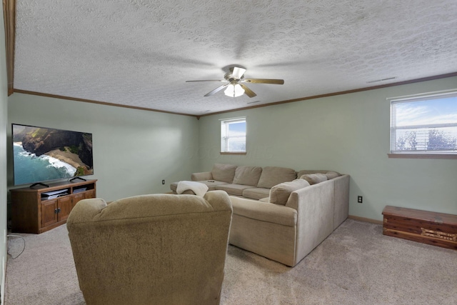 living room with light carpet, a textured ceiling, ornamental molding, and a ceiling fan