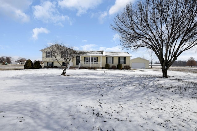 view of front of property with a detached garage