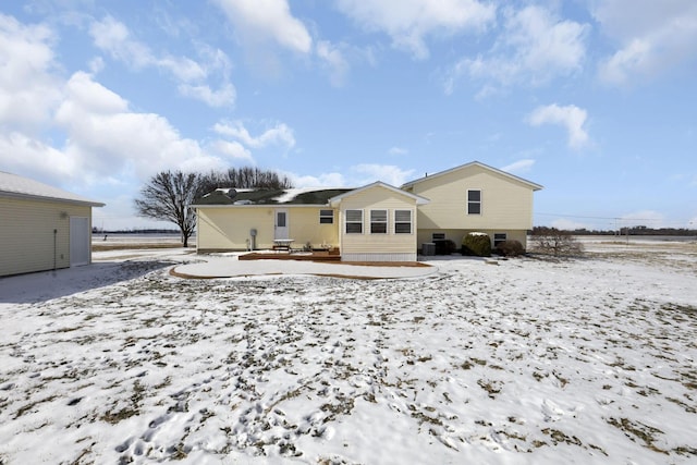 view of snow covered house