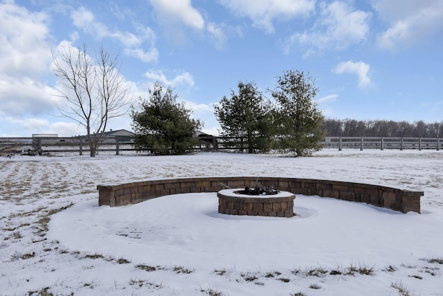 yard covered in snow with fence