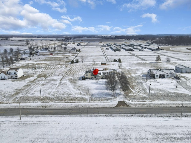 snowy aerial view with a rural view