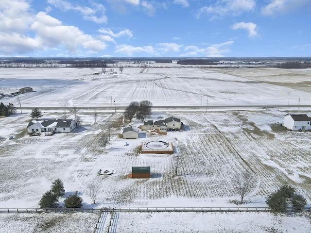 snowy aerial view featuring a rural view