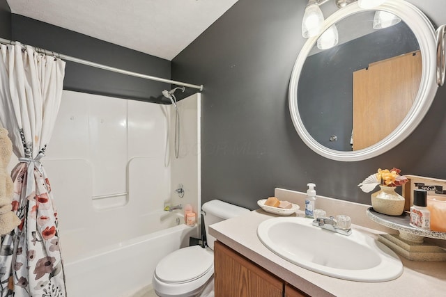 full bathroom featuring shower / bath combination with curtain, vanity, and toilet