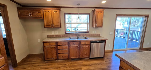 kitchen with dishwasher, sink, dark hardwood / wood-style flooring, hanging light fixtures, and ornamental molding