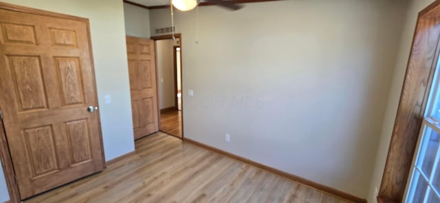 unfurnished bedroom featuring light hardwood / wood-style floors and ceiling fan