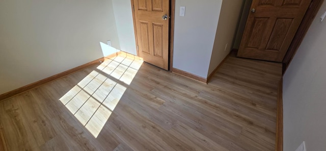 spare room featuring light wood-type flooring