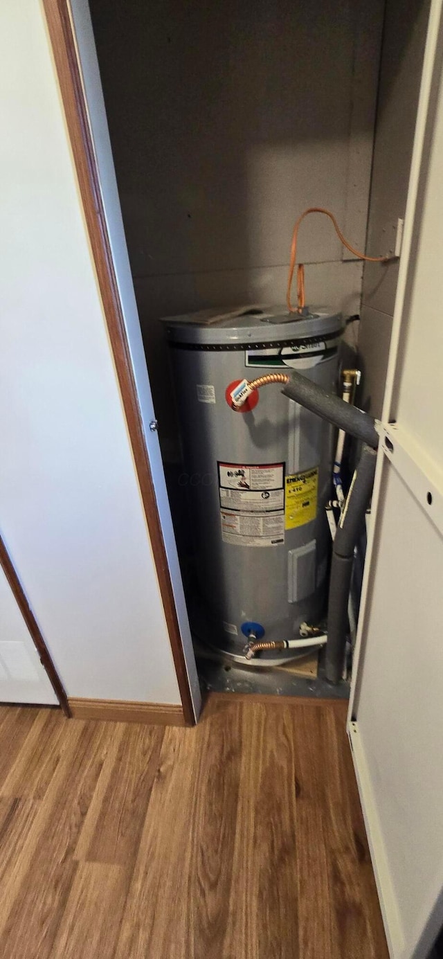 utility room featuring water heater