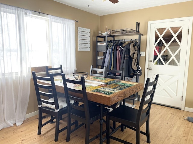 dining area featuring ceiling fan and light hardwood / wood-style flooring