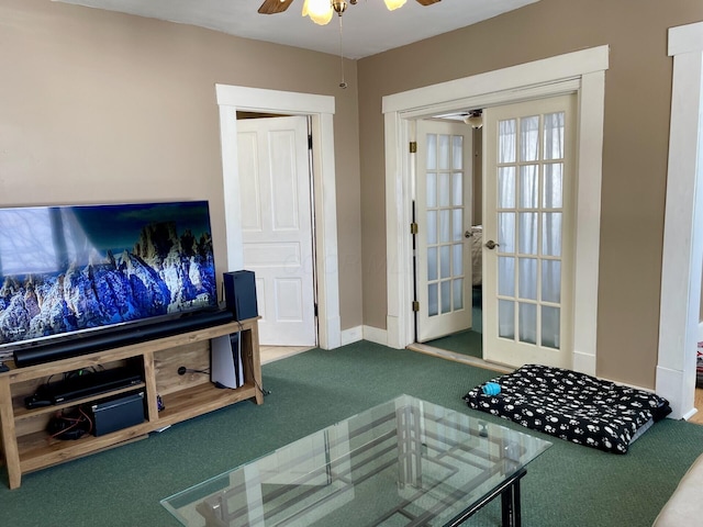 living room featuring carpet and ceiling fan