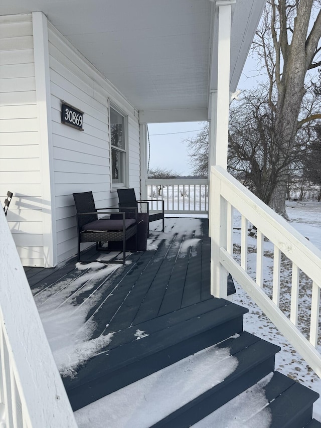 view of snow covered deck