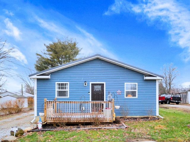 back of house featuring a deck