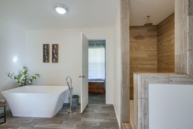 bathroom featuring hardwood / wood-style floors and separate shower and tub