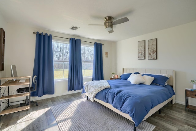 bedroom featuring dark hardwood / wood-style floors and ceiling fan