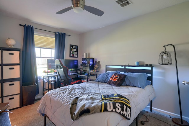 bedroom featuring ceiling fan and carpet