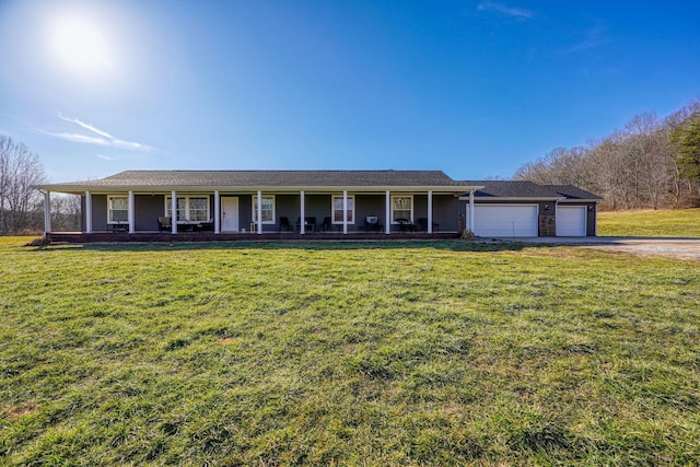 ranch-style house with a garage, covered porch, and a front yard