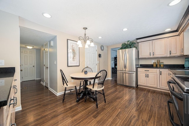 dining space with baseboards, dark wood-type flooring, a textured ceiling, a chandelier, and recessed lighting