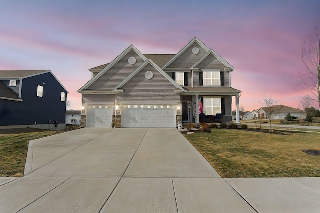 front facade featuring a yard and covered porch