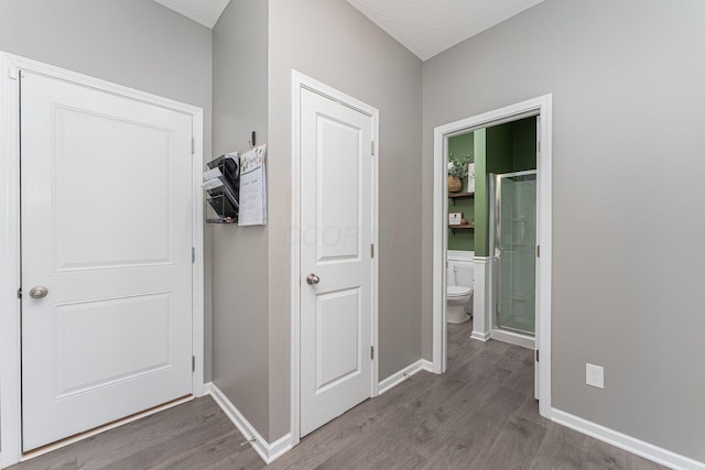 hall with hardwood / wood-style floors