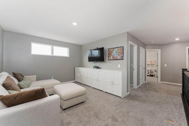 living room with light carpet and a textured ceiling