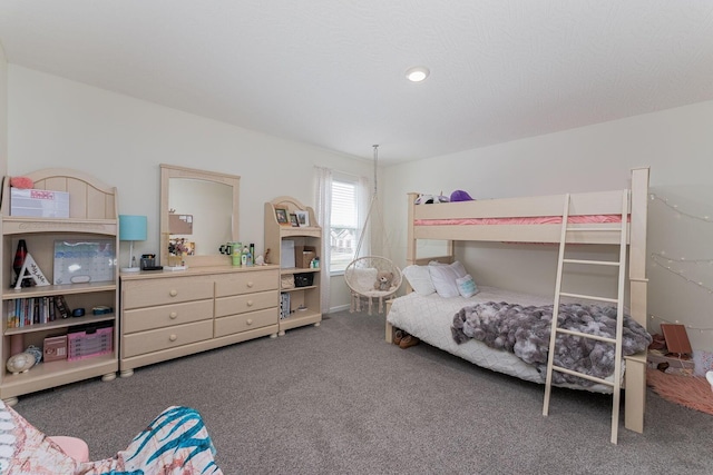 bedroom featuring dark colored carpet