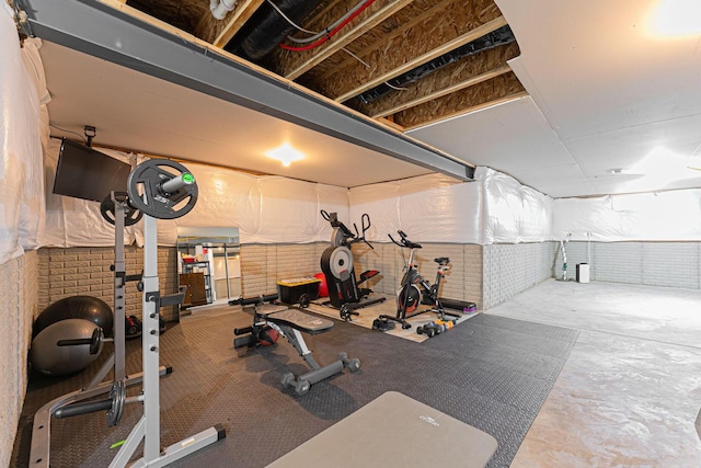 workout area with brick wall