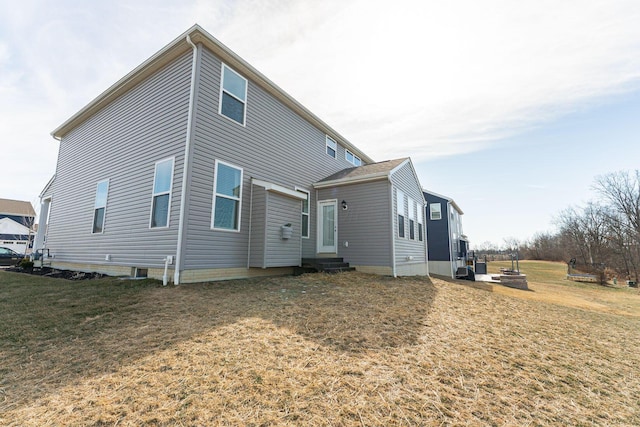 rear view of house with a lawn