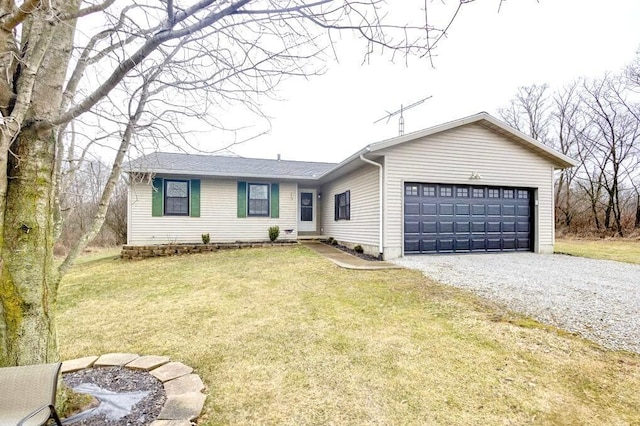 single story home featuring a garage and a front yard