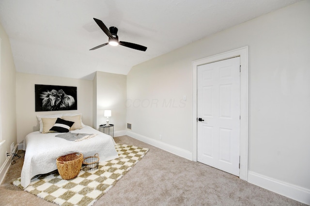 bedroom featuring ceiling fan, lofted ceiling, and carpet floors