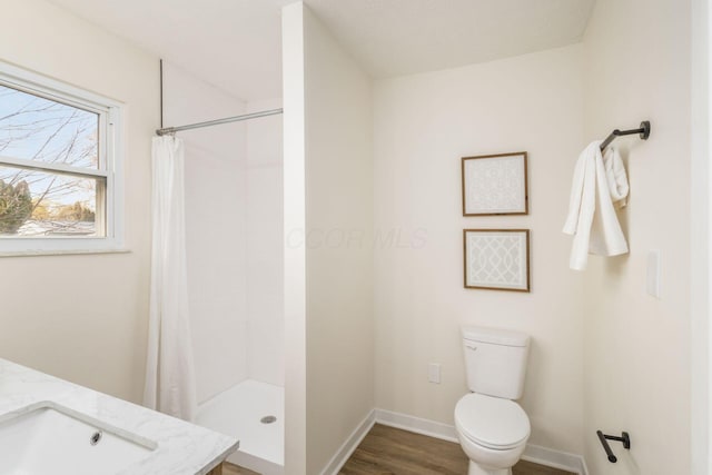 bathroom with vanity, hardwood / wood-style flooring, toilet, and a shower with shower curtain