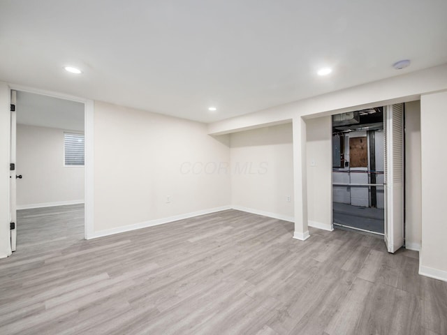 basement featuring light hardwood / wood-style floors