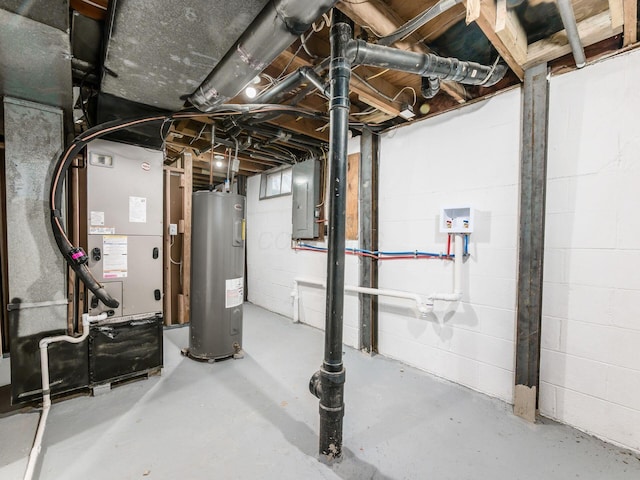 basement featuring electric water heater and electric panel