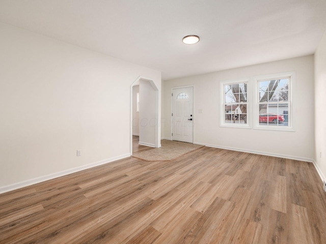 unfurnished room with light hardwood / wood-style flooring