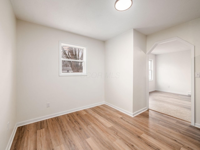 spare room with light hardwood / wood-style floors