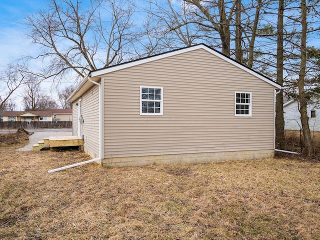 view of home's exterior with a yard