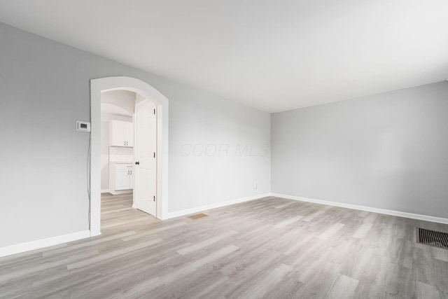 spare room featuring light hardwood / wood-style floors