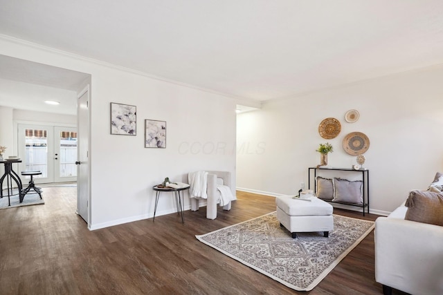 sitting room with baseboards, dark wood-style floors, and french doors