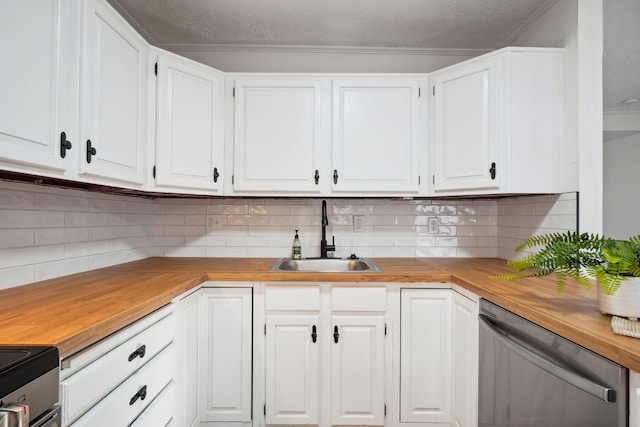 kitchen with stainless steel dishwasher, tasteful backsplash, butcher block counters, white cabinetry, and a sink