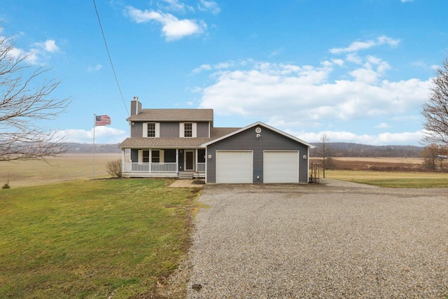 view of front of house with a garage, covered porch, and a front yard