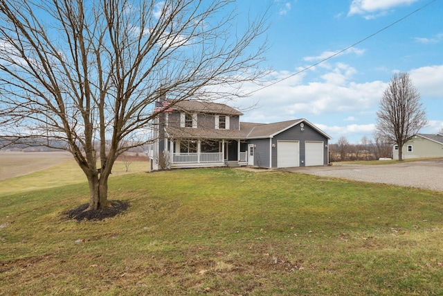 view of front of house with a porch, a garage, and a front yard