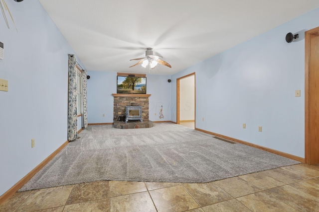 unfurnished living room with ceiling fan and carpet floors