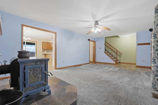 carpeted living room with ceiling fan