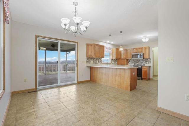 kitchen featuring tasteful backsplash, decorative light fixtures, stainless steel appliances, and kitchen peninsula