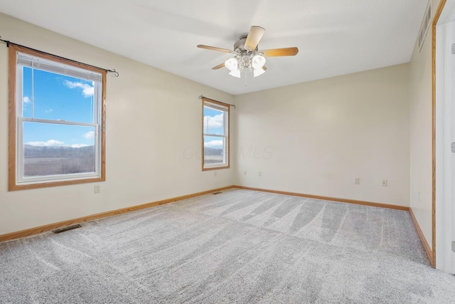 carpeted empty room with ceiling fan