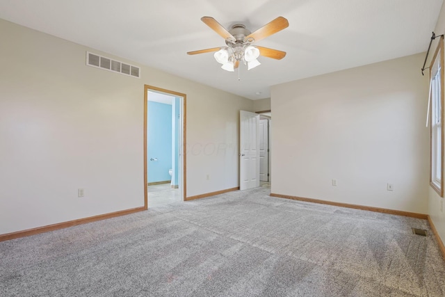 unfurnished bedroom with light colored carpet and ceiling fan